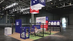 20x20 Island booth design by Reaction Space